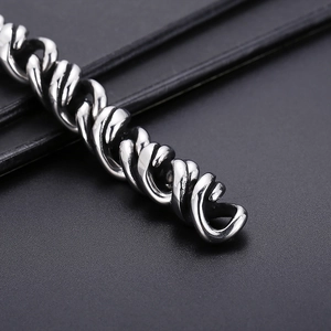 Close-up of polished silver titanium steel chain with high-density woven texture