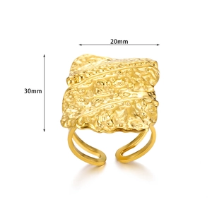 Detail view of 18K gold plated titanium steel ring featuring lava hammered texture design
