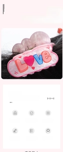 Detail of a 6cm pink frosted hair claw clip with embossed Love letters and heart patterns