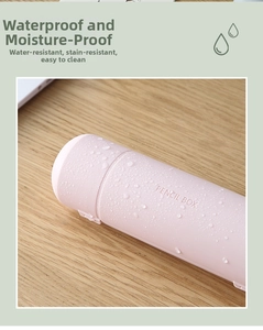 Waterproof pale pink cylindrical pencil box detail showing water droplets on the surface