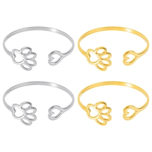Detailed set of 18k gold and silver adjustable open bangles with paw and heart charms