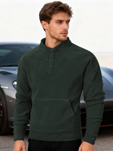 Detail of forest green fleece sweatshirt with button collar and kangaroo pocket