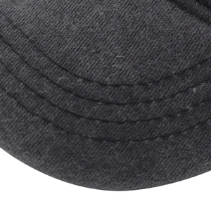 Close-up of three parallel stitches on vintage washed grey cotton baseball cap brim
