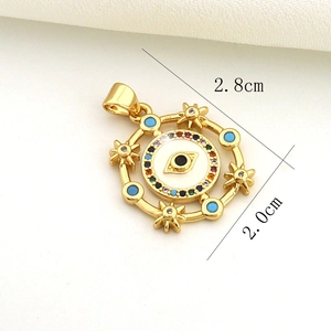 Detailed close-up of golden evil eye pendant with dimensions 2.8cm by 2.0cm