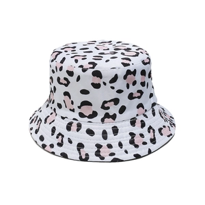 Detail of trendy bucket hat showing pink leopard print patterns on high-quality fabric