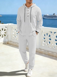 Detail of white linen hooded set for men featuring button neckline and drawstring details