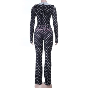 Back view of polka dot hooded jumpsuit with pink Iam Girl text on the seat and flared legs