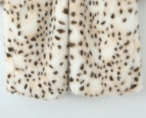 Detail of leopard print faux fur coat featuring soft texture and plush finish