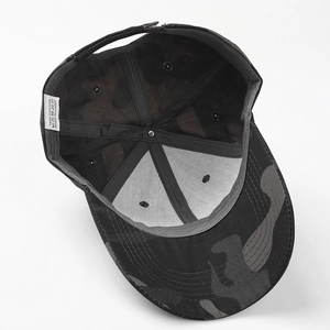 Detail view of cotton camouflage baseball cap interior with 100% cotton wash label tag