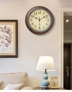 Detail view of a 30cm vintage Nordic wall clock in a cozy living room setting