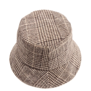 Close-up top-down view of vintage plaid wool bucket hat with classic checkered texture