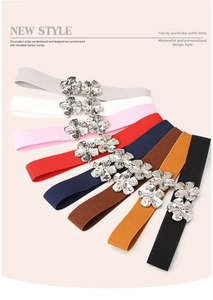 Selection of eight colorful elastic waist belts featuring decorative silver floral buckles
