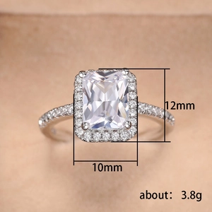 Macro view of 10x12mm emerald cut zirconia ring with halo setting and 3.8g silver band