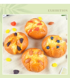 Detailed set of realistic artificial muffins with berry and nut toppings on linen cloth