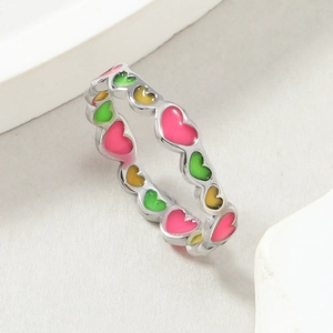 Titanium steel ring with colorful enamel heart patterns shown from a 45-degree angle
