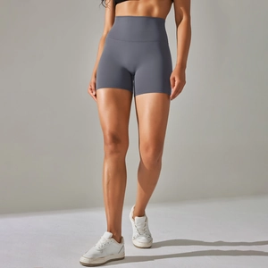 Macro detail of high-waisted seamless fitness shorts in matte grey for yoga and gym