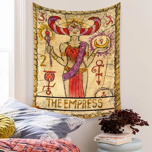 Detail view of The Empress tarot card tapestry hanging in a cozy boho bedroom setting