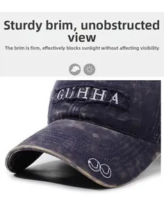 Detail of sturdy brim on washed denim baseball cap with GUHHA embroidery and stitching