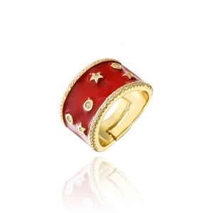 Macro detail of red enamel ring featuring gold star patterns and zircon-studded edges
