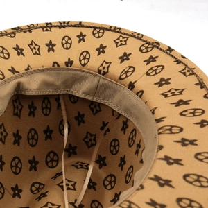 Brown wide brim wool felt jazz hat featuring monogram prints and adjustable chin strap