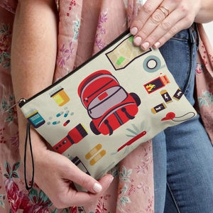 Cream canvas toiletry bag with colorful outdoor tools print and black zipper closure
