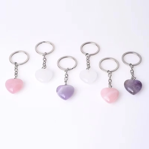 Set of 6 natural crystal heart keychains in pink, white, and purple gemstone variants