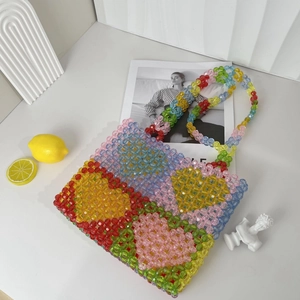 Handmade heart-patterned beaded tote bag with colorful acrylic beads in a vibrant summer style