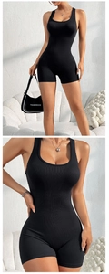 Close-up of ribbed seamless fabric texture on a black slimming one-piece yoga romper