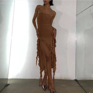 Detail of ruched bodycon dress in brown with ruffled irregular hem and strapless design