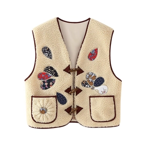 Vintage beige sherpa vest with floral patchwork details and wooden horn buttons