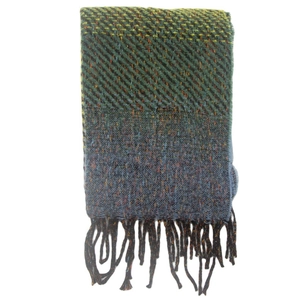 Detail of multi-color knit scarf with herringbone pattern and orange fringe accents