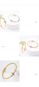 Détail des bracelets d'avion en acier inoxydable plaqué or 18 carats avec ailes rayées