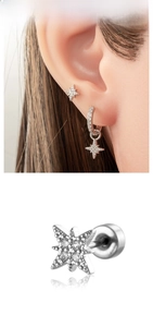Macro detail of silver star studs and hoop earrings with sparkling cubic zirconia