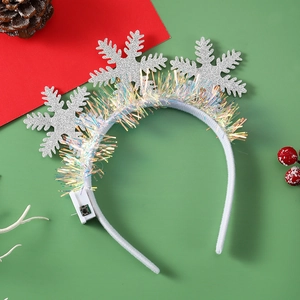 Detail of LED silver snowflake headband with iridescent tinsel and battery control switch