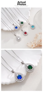 Macro shot of pear-shaped emerald pendant necklace with double-layer zircon halo