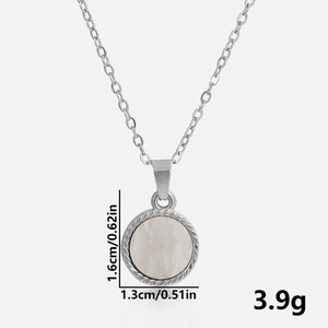 Close-up of stainless steel shell pendant with detailed size and weight measurements