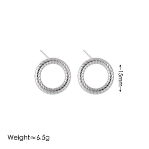 Macro detail of 15mm silver stainless steel hoop earrings with twisted rope texture and 6.5g weight