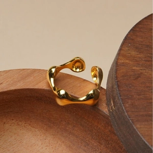 Minimalist 925 sterling silver ring with irregular wave design and polished gold finish