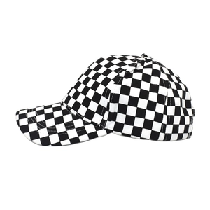 Close-up of checkerboard baseball cap with reinforced brim and detailed stitching