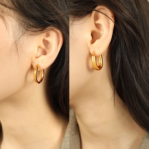 Minimalist 18K gold plated U-shaped and round hoop earrings for women shown on model