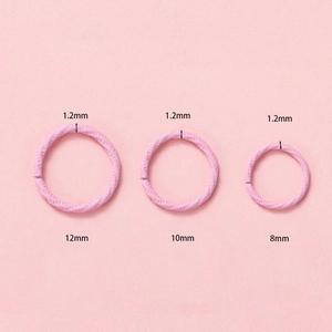 Detailed comparison of 1.2mm pink embossed jump rings in 8mm, 10mm and 12mm sizes
