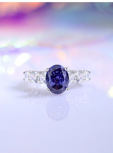 Detail of s925 sterling silver ring featuring a large oval tanzanite purple zircon stone