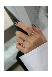 Detailed view of minimalist S925 sterling silver geometric beaded rings on a hand