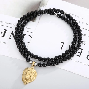 Men's necklace with 8mm black onyx beads and a detailed golden lion head pendant