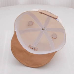 Detailed interior view showing stitching and reinforced tape on a baby bear baseball cap
