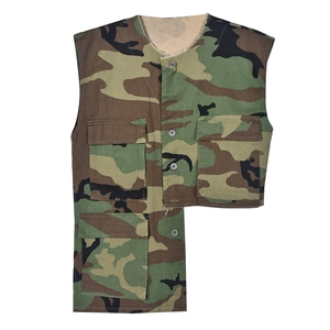 Detail view of camouflage tactical vest with asymmetrical cut and multiple pockets