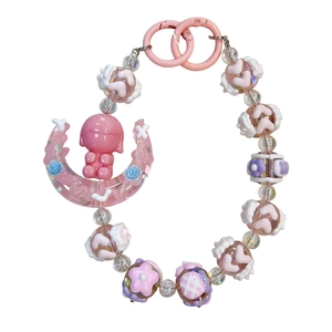 Handmade beaded keychain with a cute pink girl on a crescent moon charm for bags