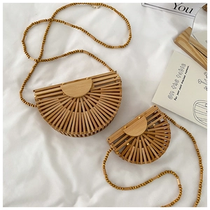 Detailed view of semi-circular bamboo woven bags with natural wooden bead straps