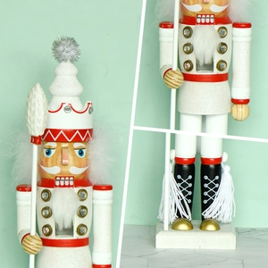 Nutcracker soldier puppet in white glitter with gold accents for Christmas home decoration