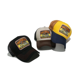 Three vintage motocross trucker hats with breathable mesh and retro embroidered patches